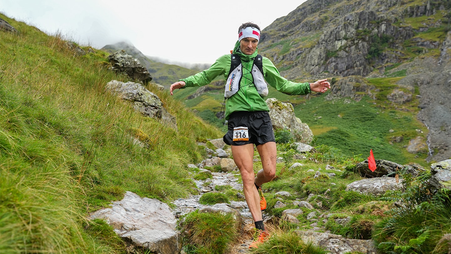 woman running downhill on the fells