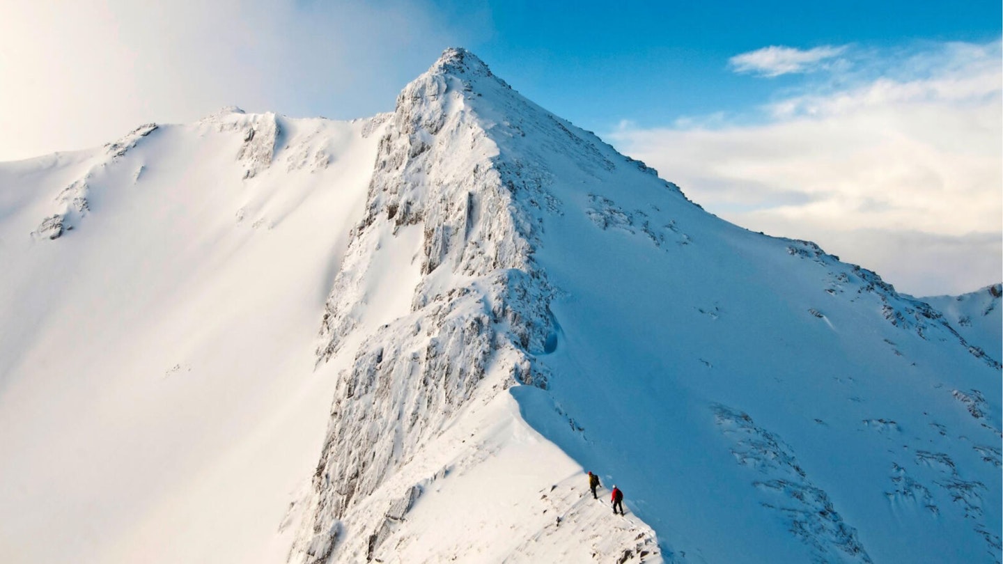 two walkers in the snow on Forcan Ridge