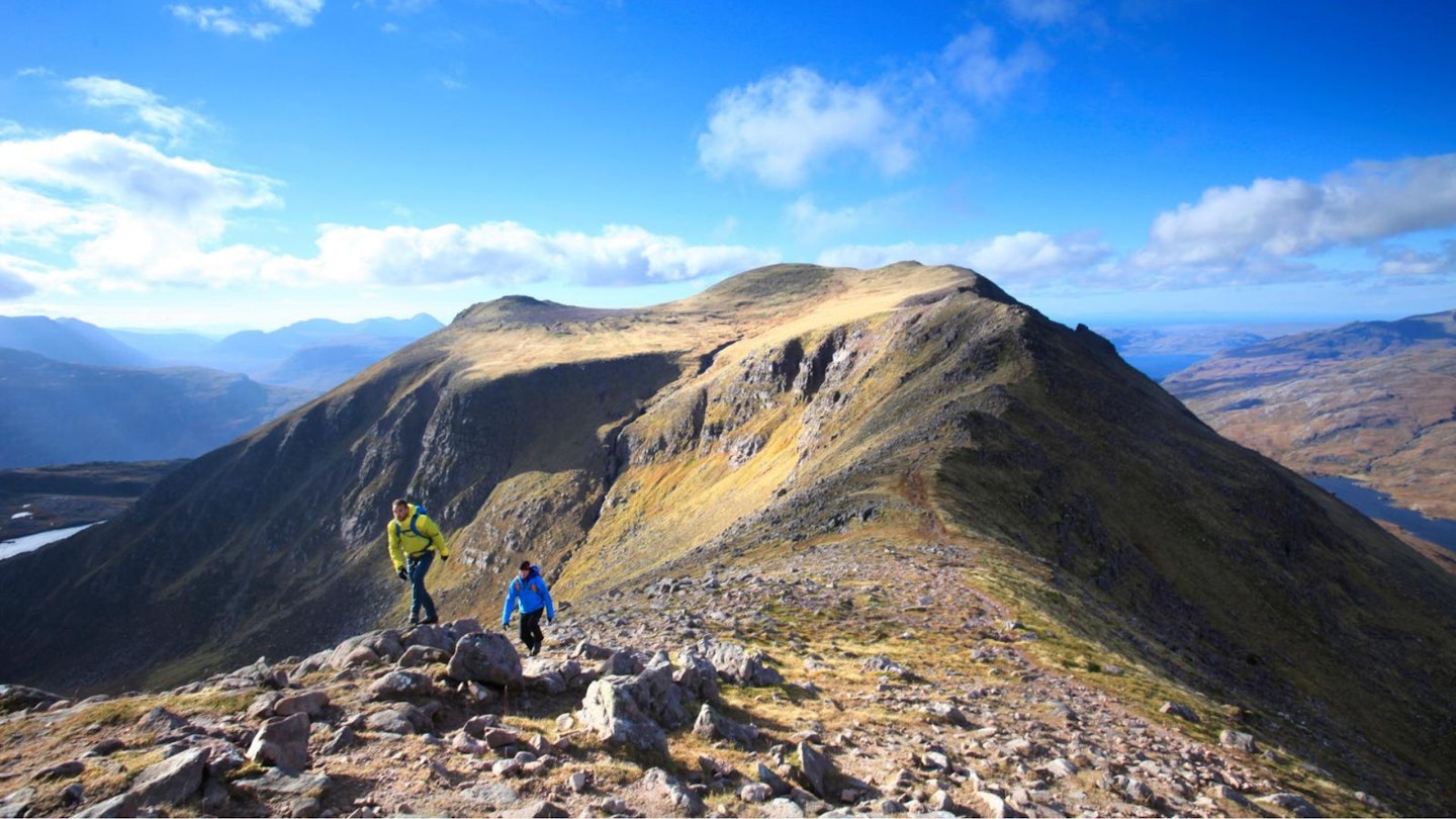 Walkers on Slioch above Loch Maree in the Scottish Highlands