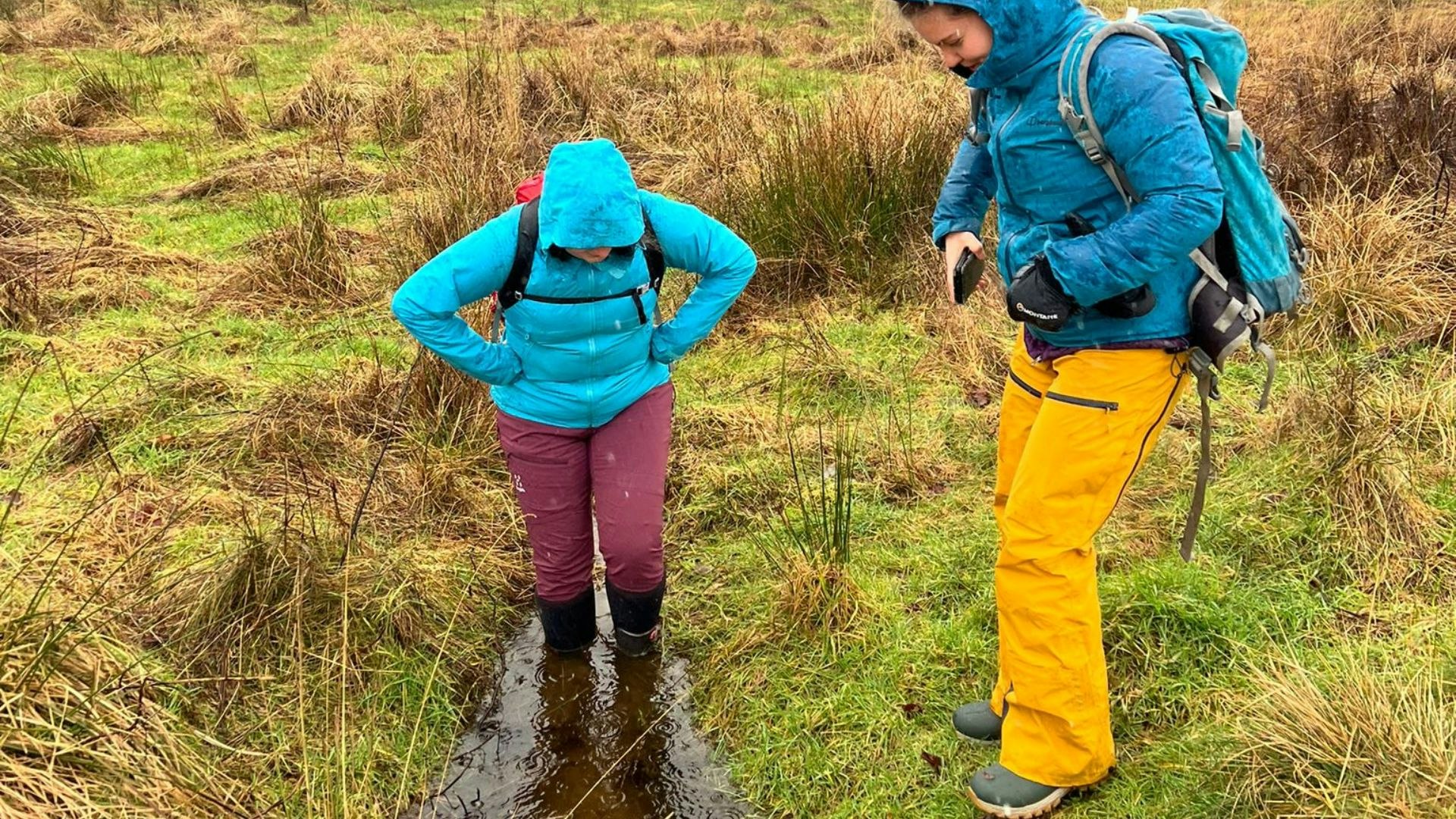Fliss and her friend test walking wellies in deep mud