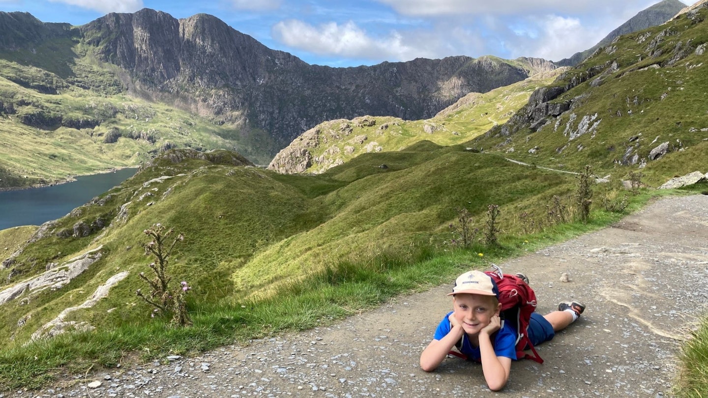 Child on the early stages of the Snowdon Pyg Track with Y Lliwedd behind