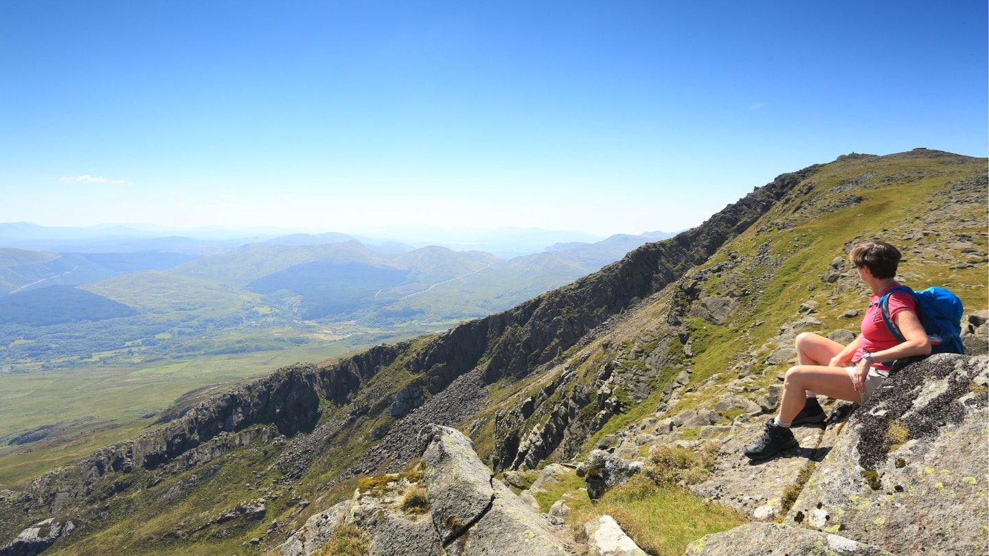 Hiker looking down the Daear Ddu ridge Moel Siabod Snowdonia