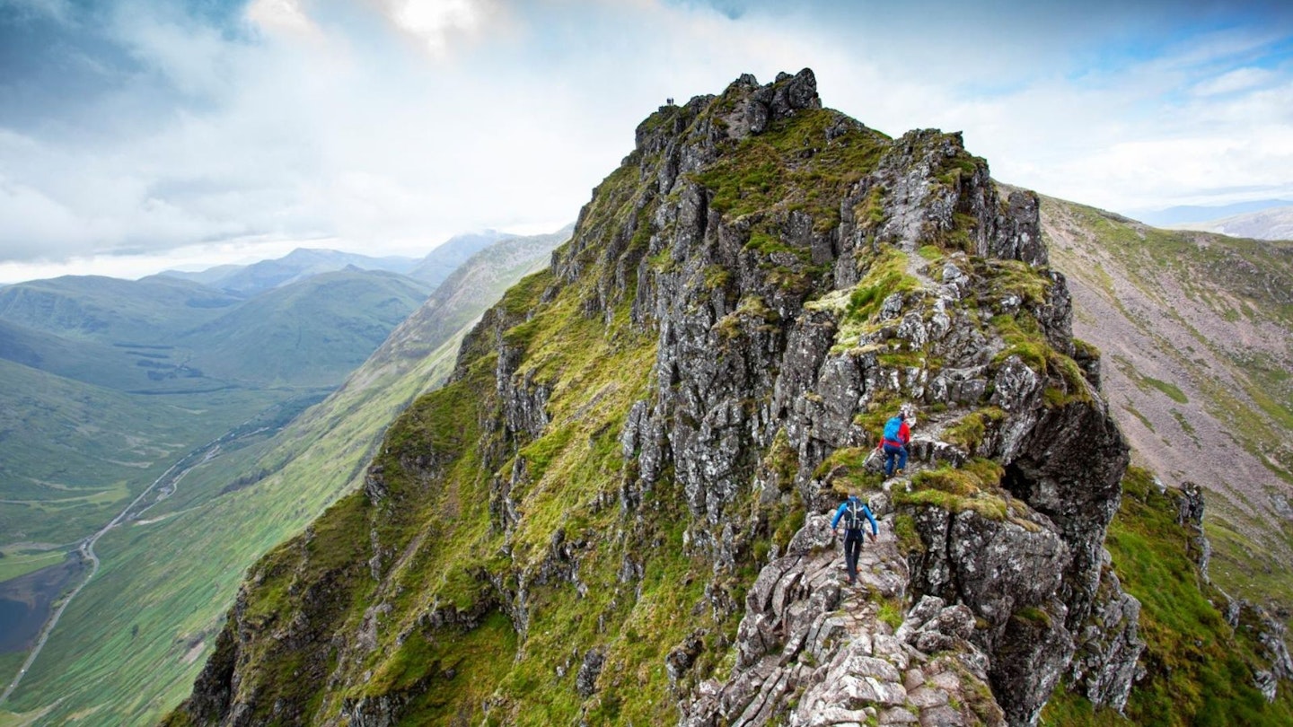 Heading towards the crazy pinnacles Aonach Eagach Glen Coe Scottish Highlands