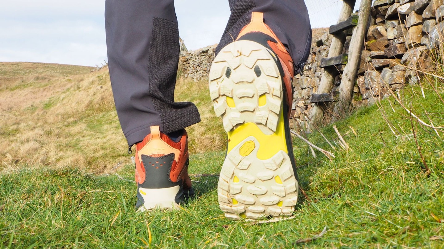 Hiker walking away from camera wearing Merrell Moab Speed 2 Mid GTX