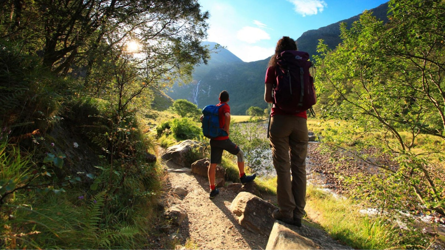 Two hikers near An Steall Waterfall Ring of Steall Glen Nevis Scotland