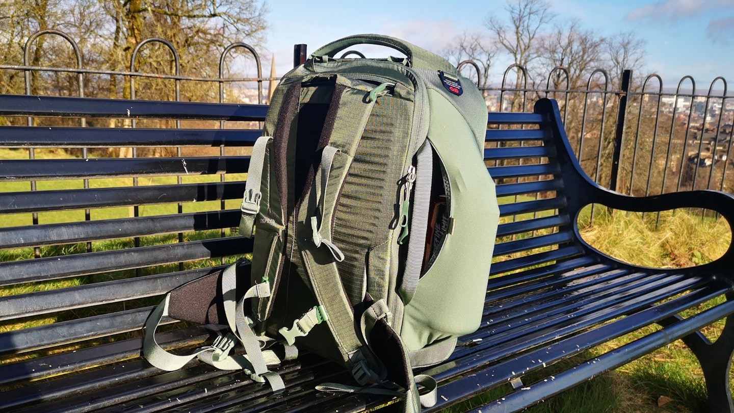 The Osprey Sojourn Porter 30L on a park bench