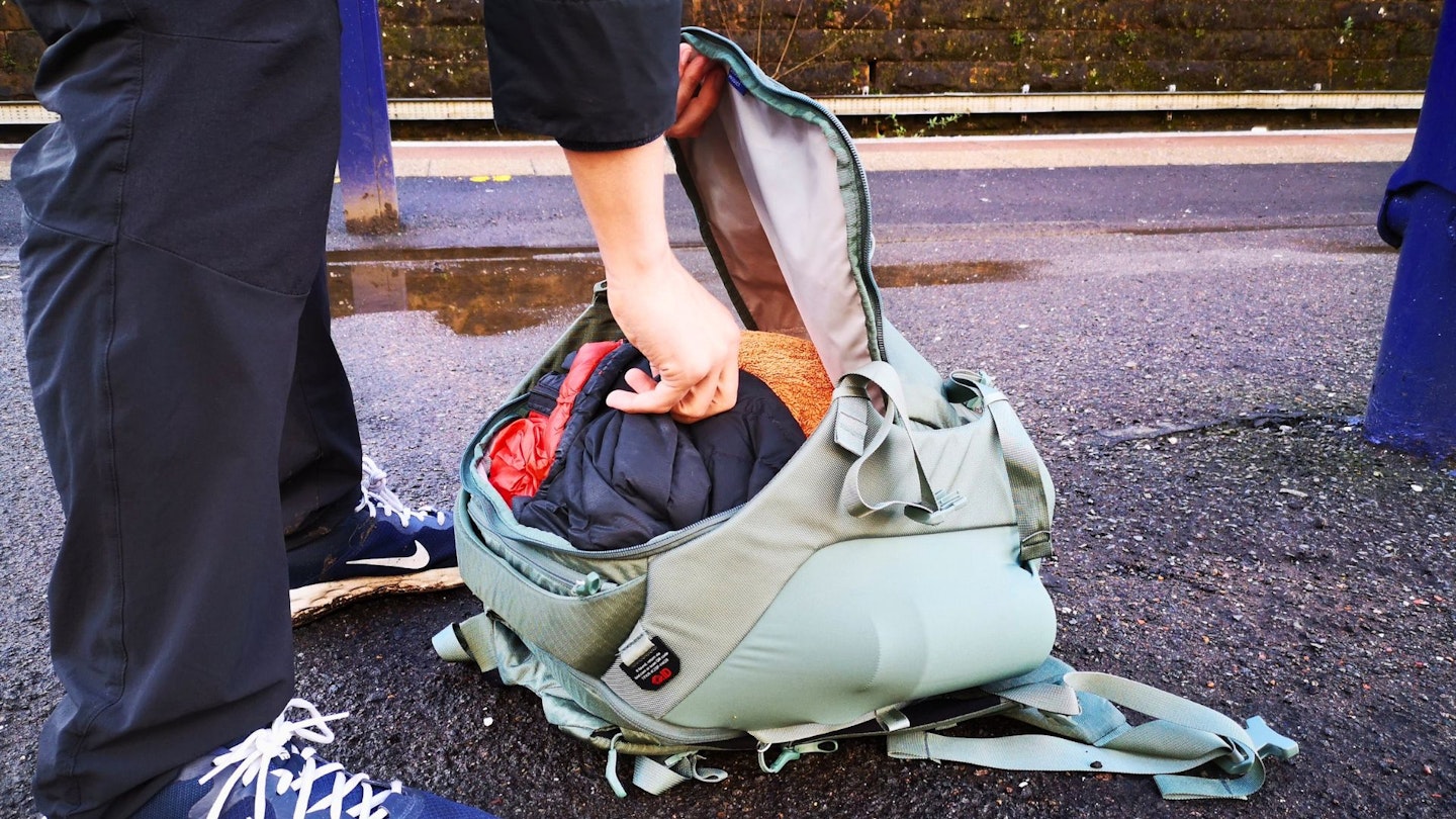 the Osprey Sojourn Porter 30L in use with hand