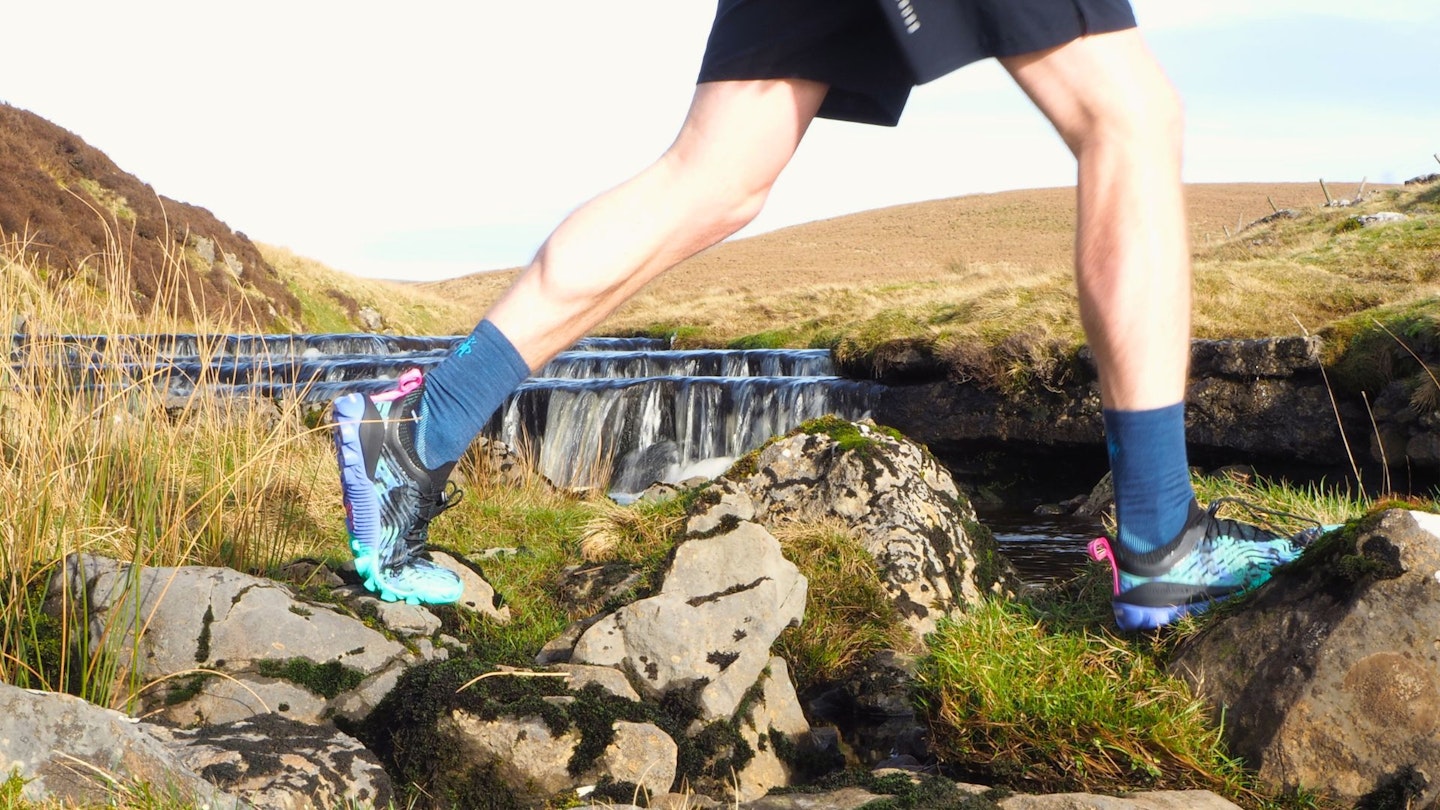 Running by a river wearing Vivobarefoot Hydra ESC