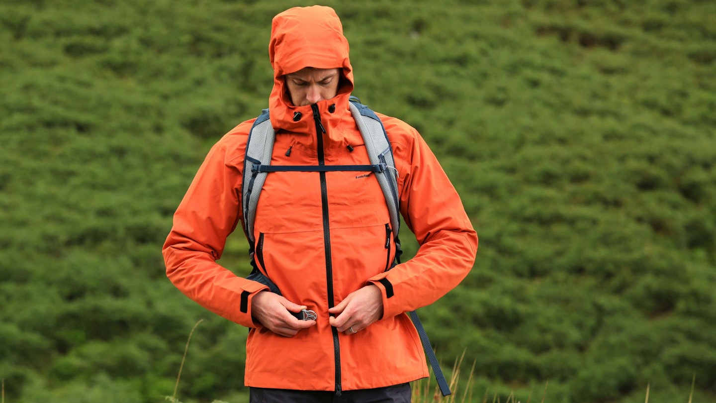 Chris Williams wearing Finisterre Stormbird Waterproof Jacket with hood up