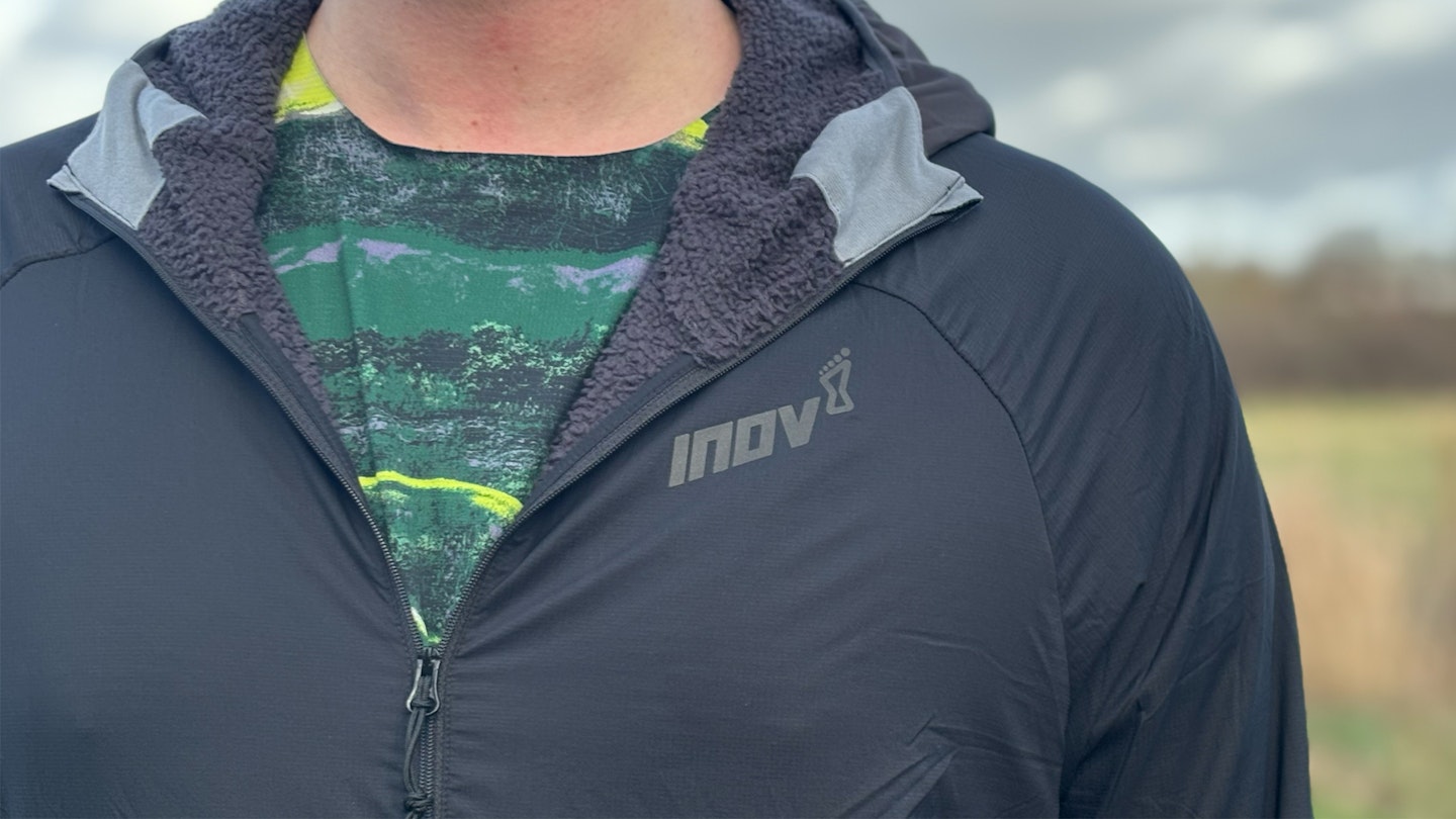 front zip and insulated hood of the inov8 performance hybrid jacket