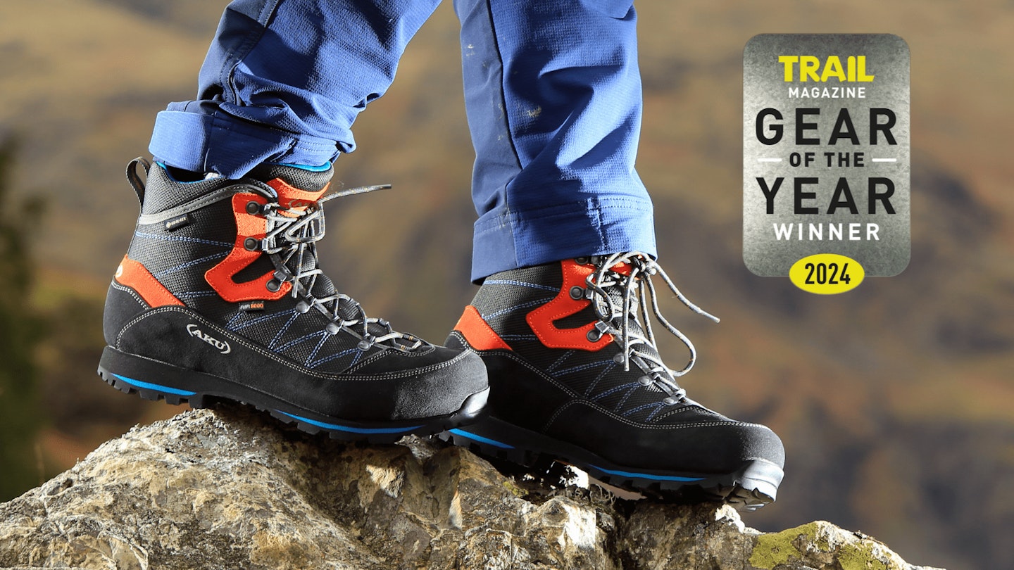 Closeup of hiker wearing AKU Trekker Lite III GTX with Gear of the Year award logo