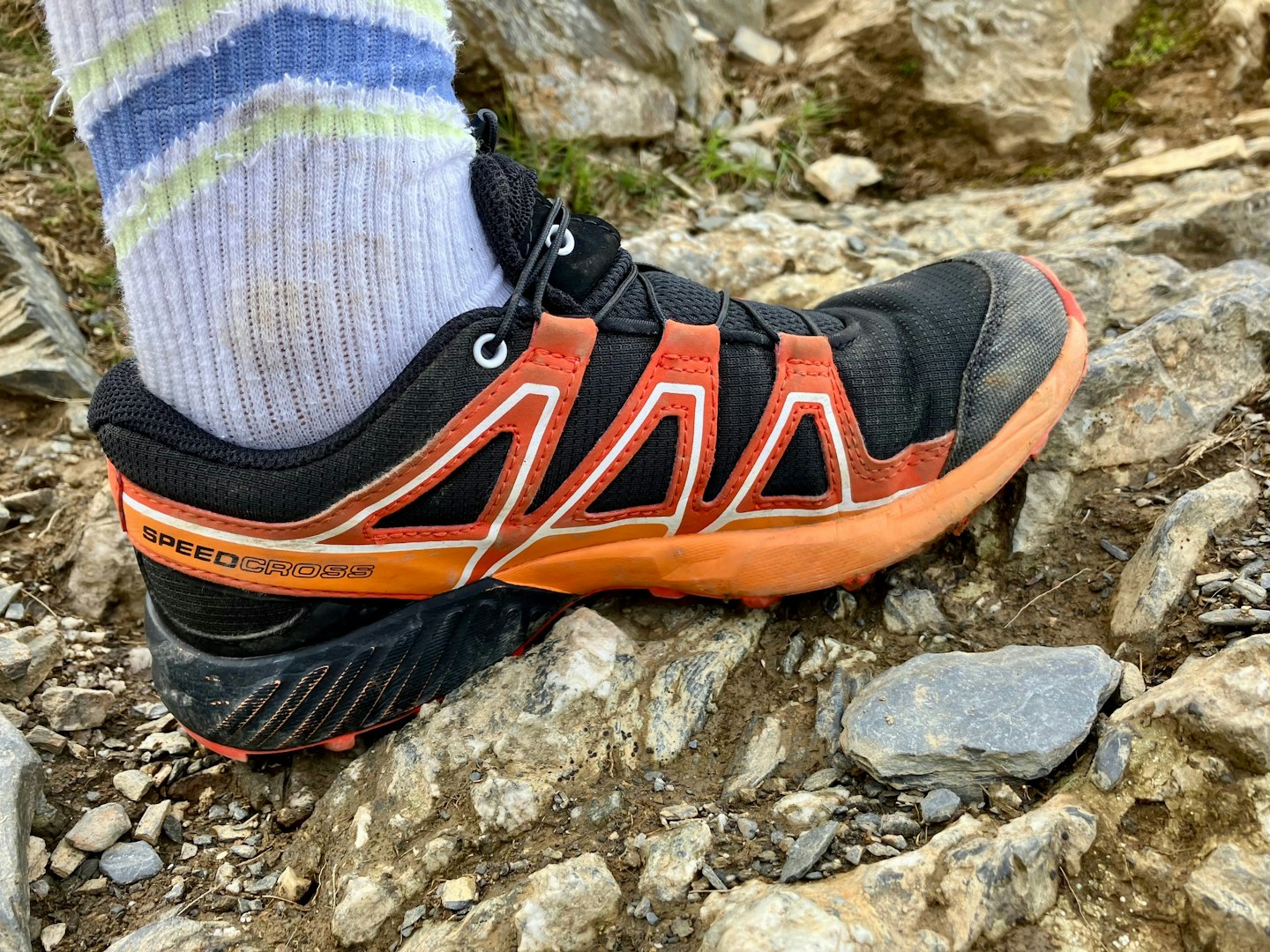 Salomon speedcross junior kids running shoe on rock