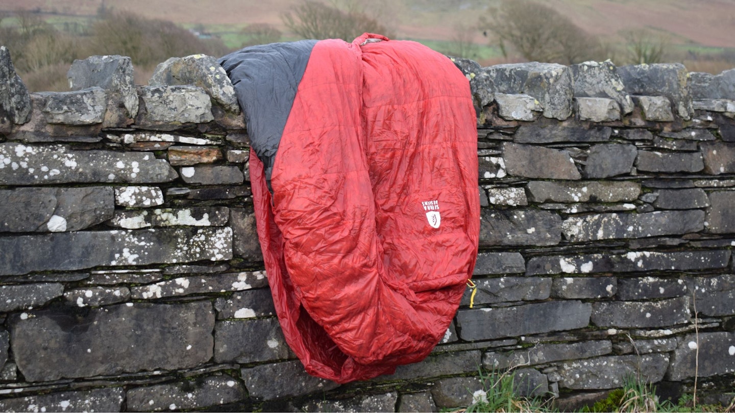 Sierra Designs Sleeping Bag on a lake district wall