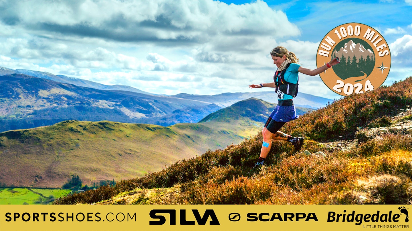 Trail runner with Run 1000 miles logo in background