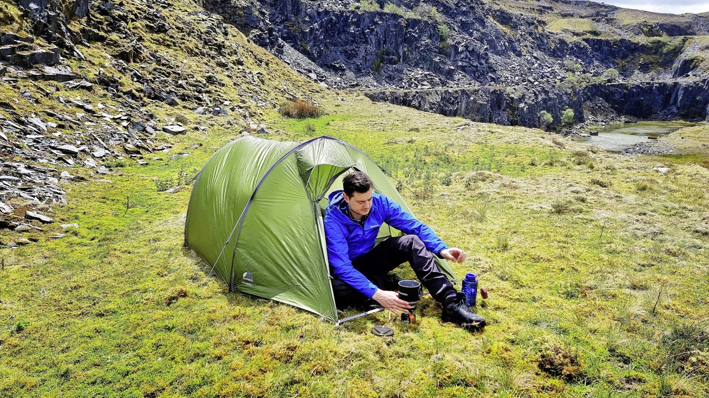 Hiker camping with a ultralightweight Vango tent
