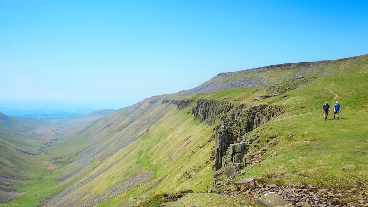 Walking on the edge of High Cup Nick Cumbria Pennines