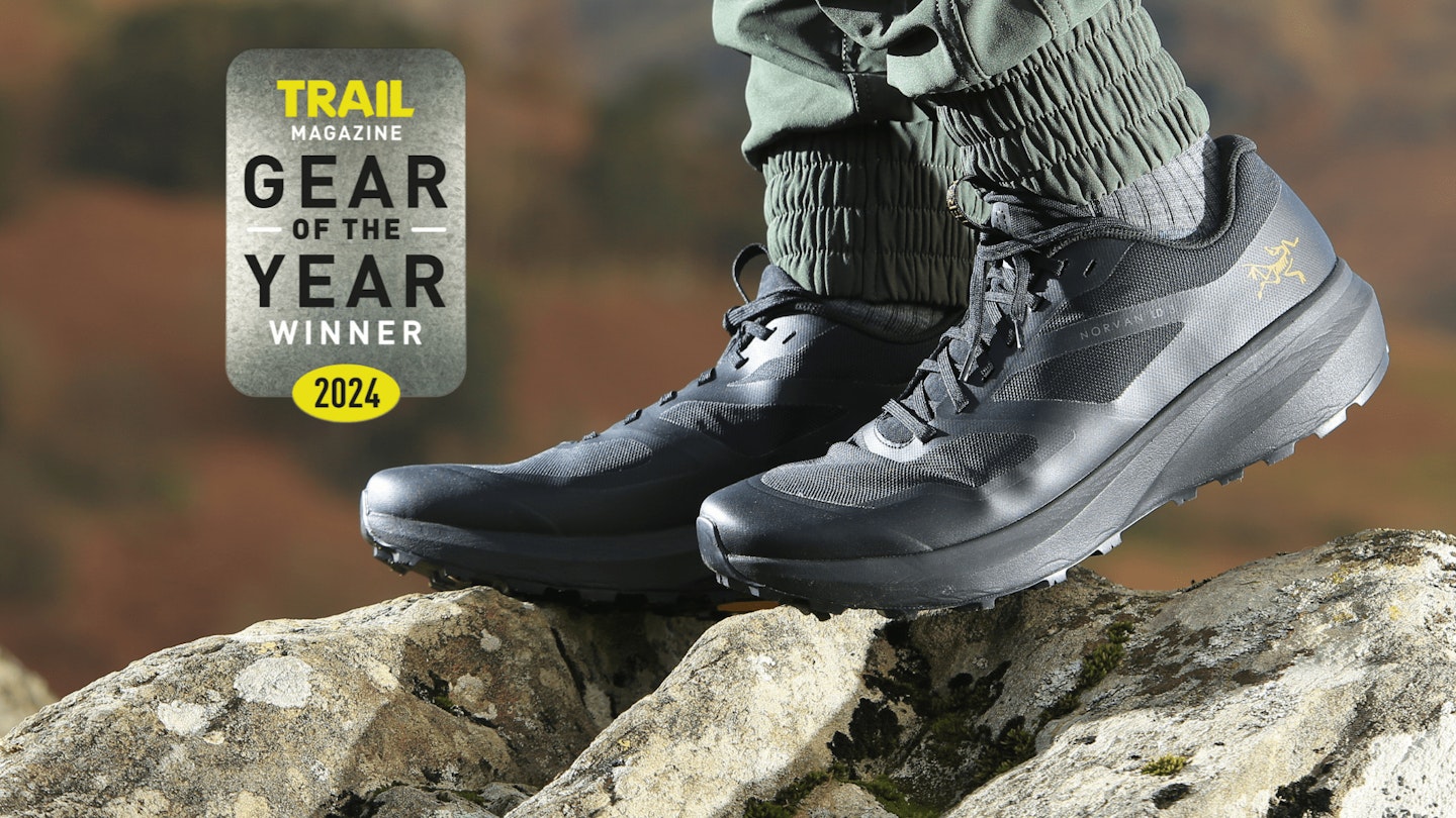 Closeup of hiker wearing Arc'teryx Norvan LD 3 Shoe with Gear of the Year award logo