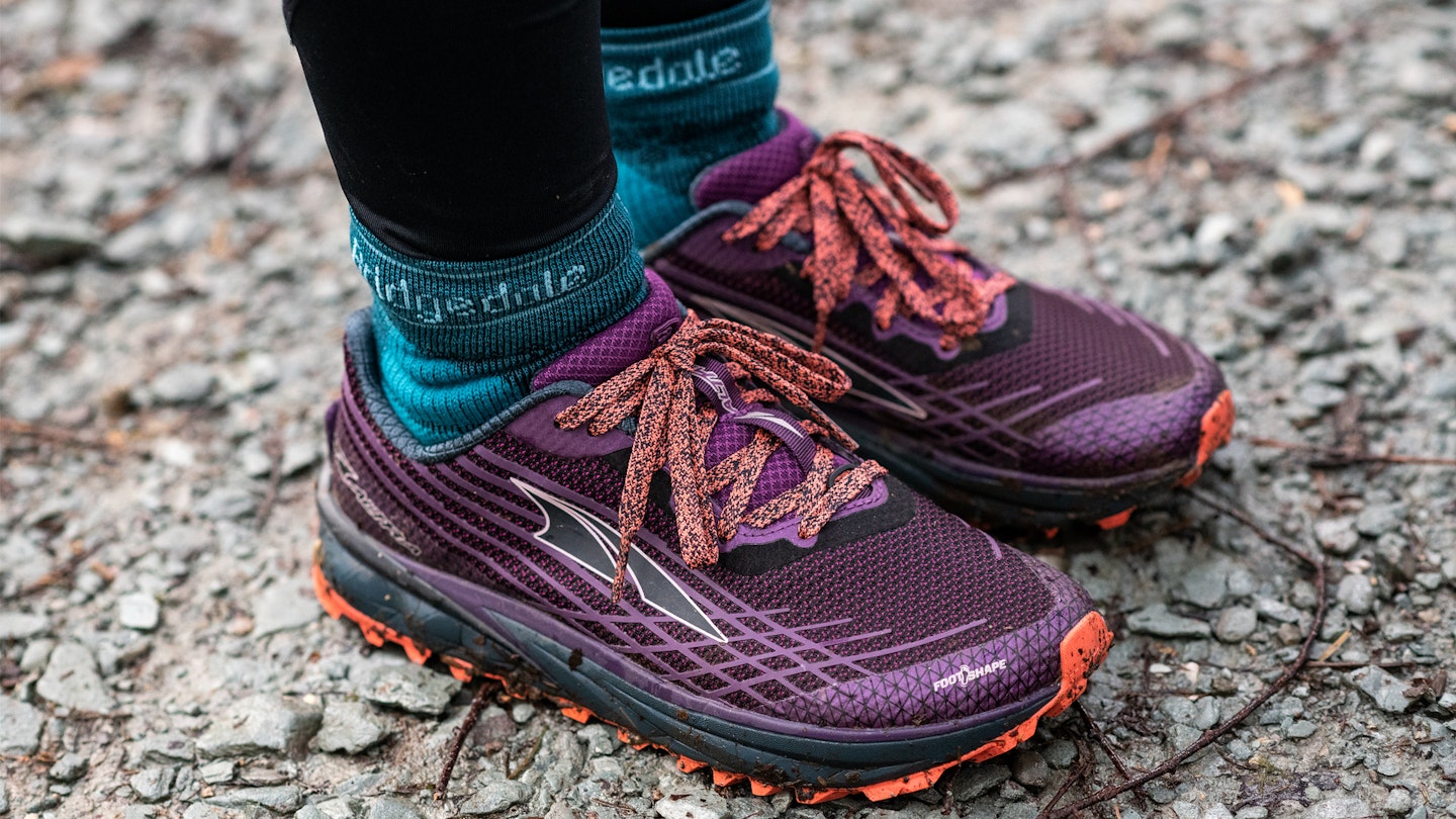 bridgedale socks in trail running shoes on rocky ground