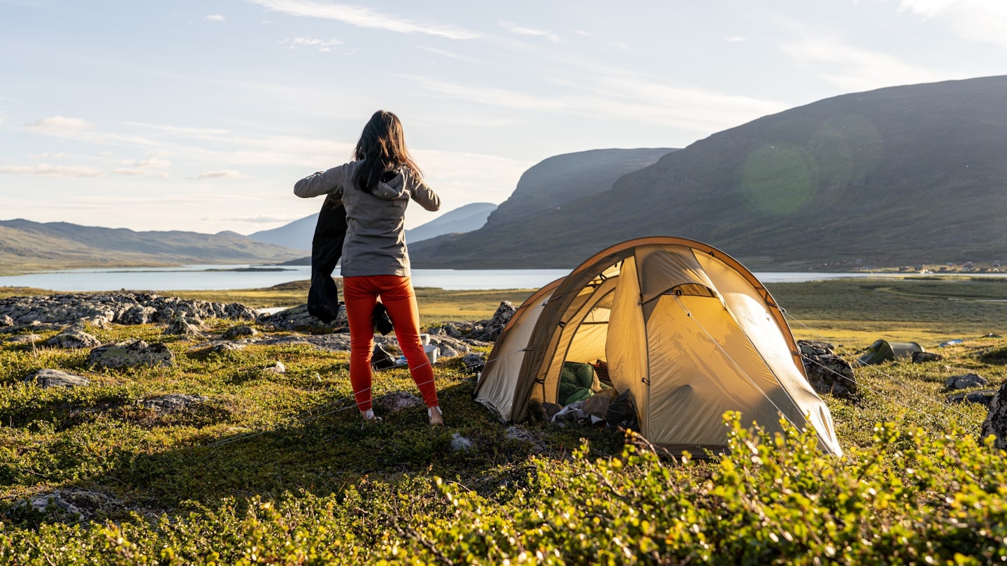 Hiker camping with a Fjallraven tent