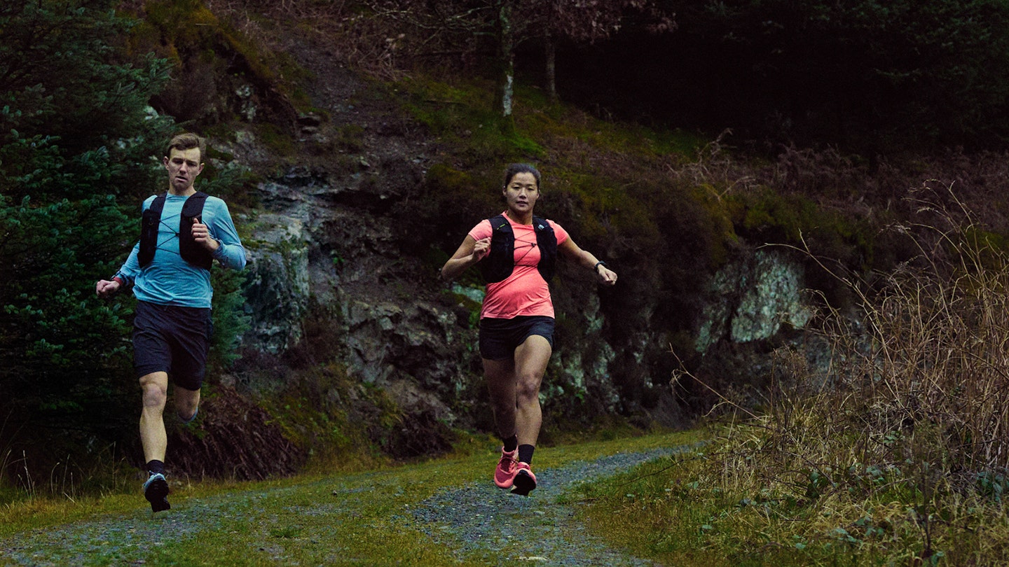 male and female trail runners in inov8 trailfly shoes
