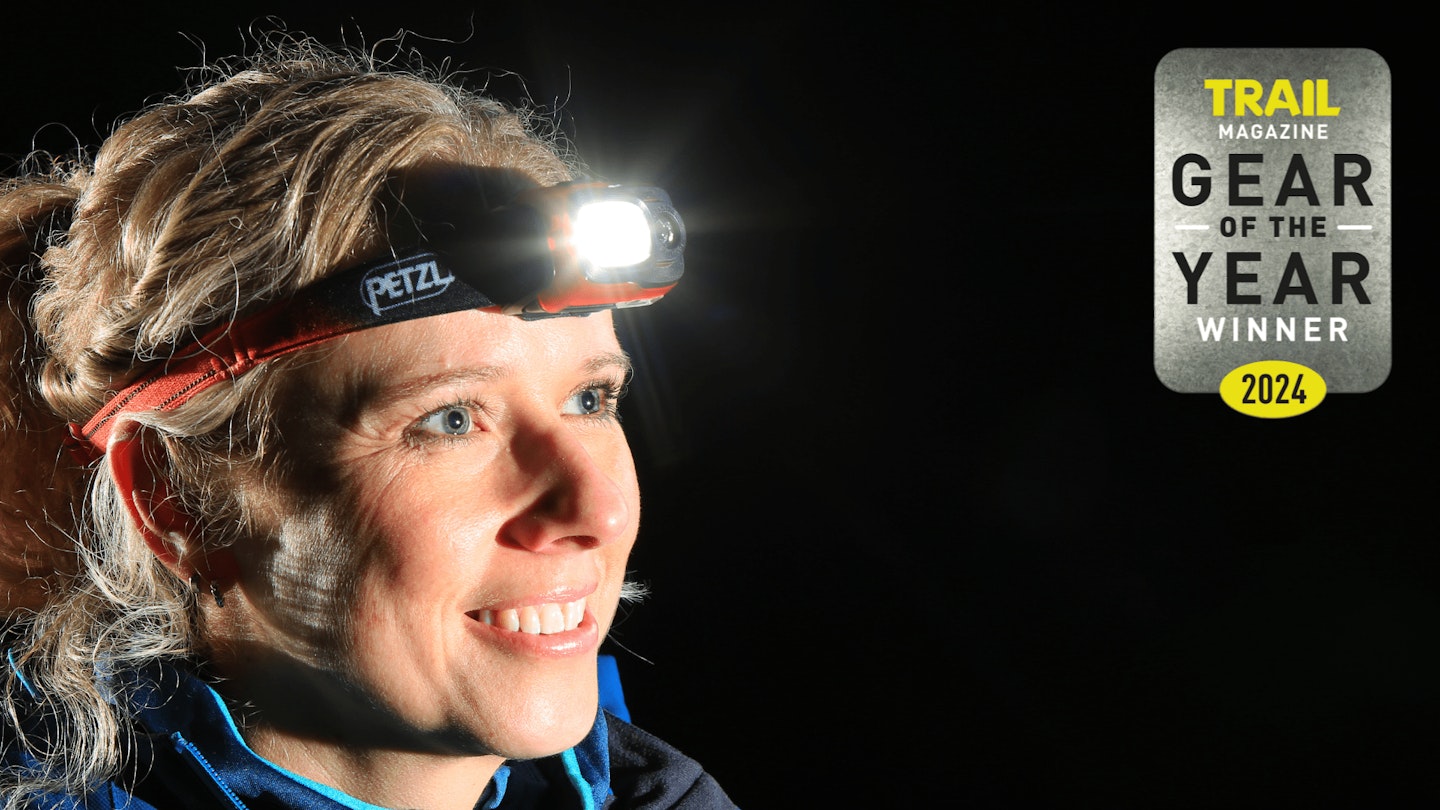 Hiker wearing Petzl Swift RL with Gear of the Year award logo