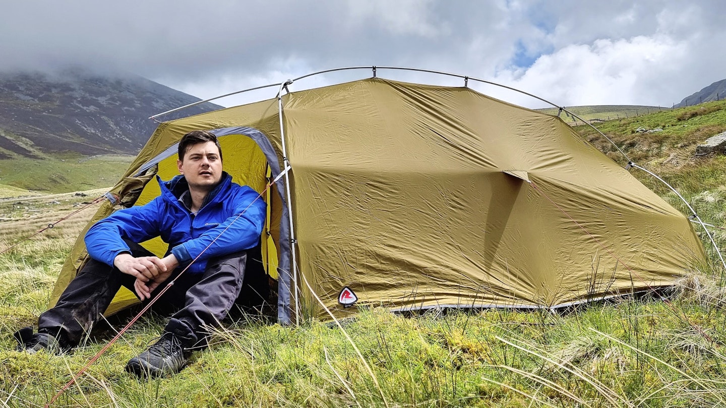 Hiker sitting in front of Robens tent