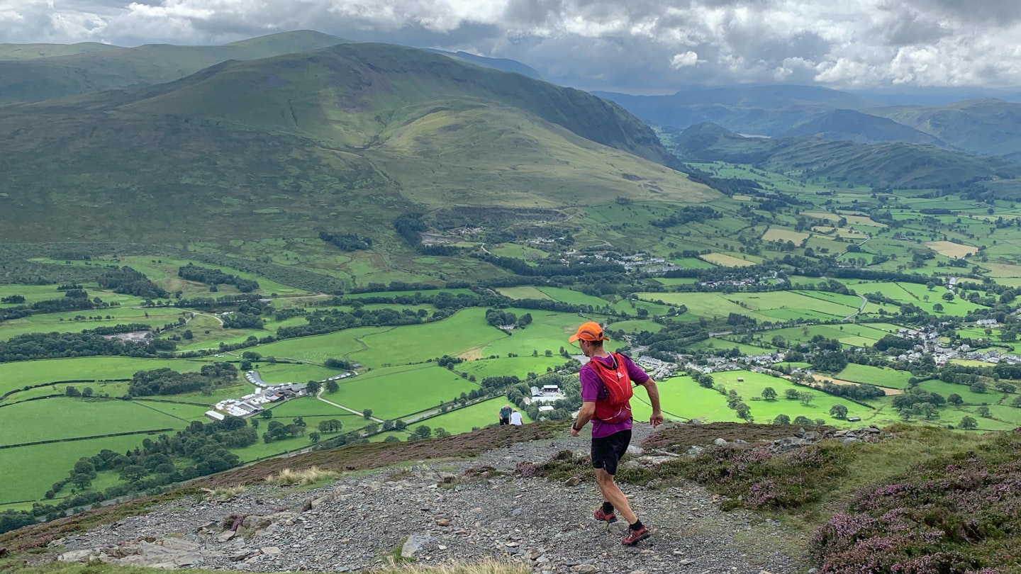 trail runner navigating through the hills of cumbria