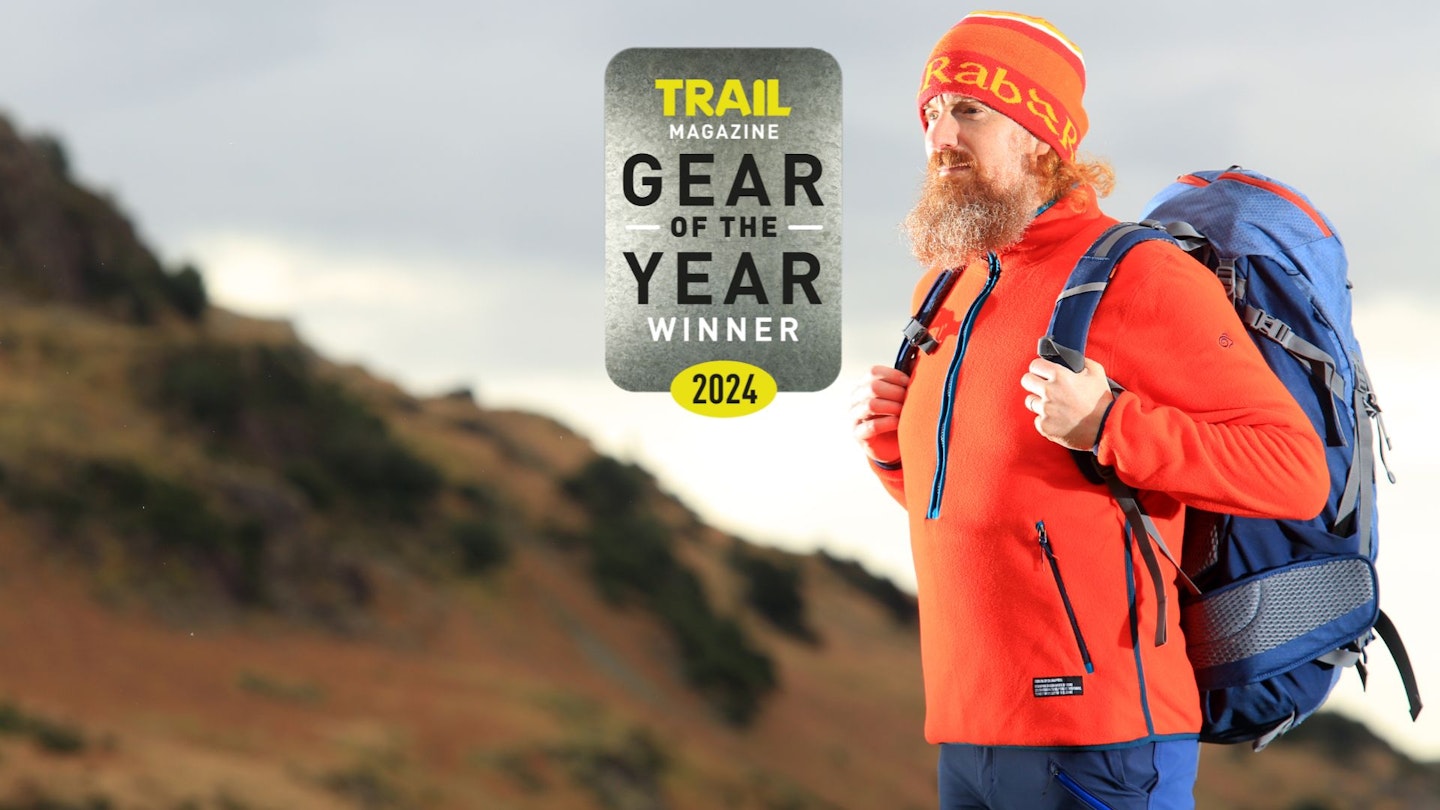 Hiker wearing Craghoppers CO2 Renu Half Zip Fleece with Gear of the Year award
