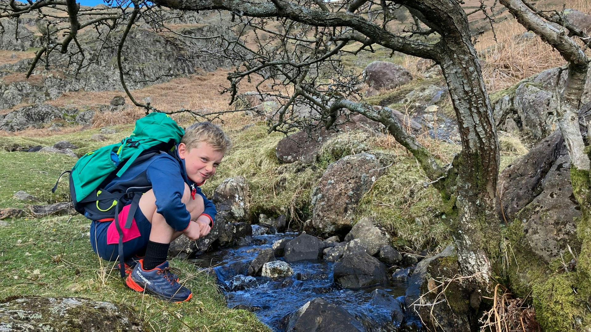 Child exploring stream on Helm Crag Lake District