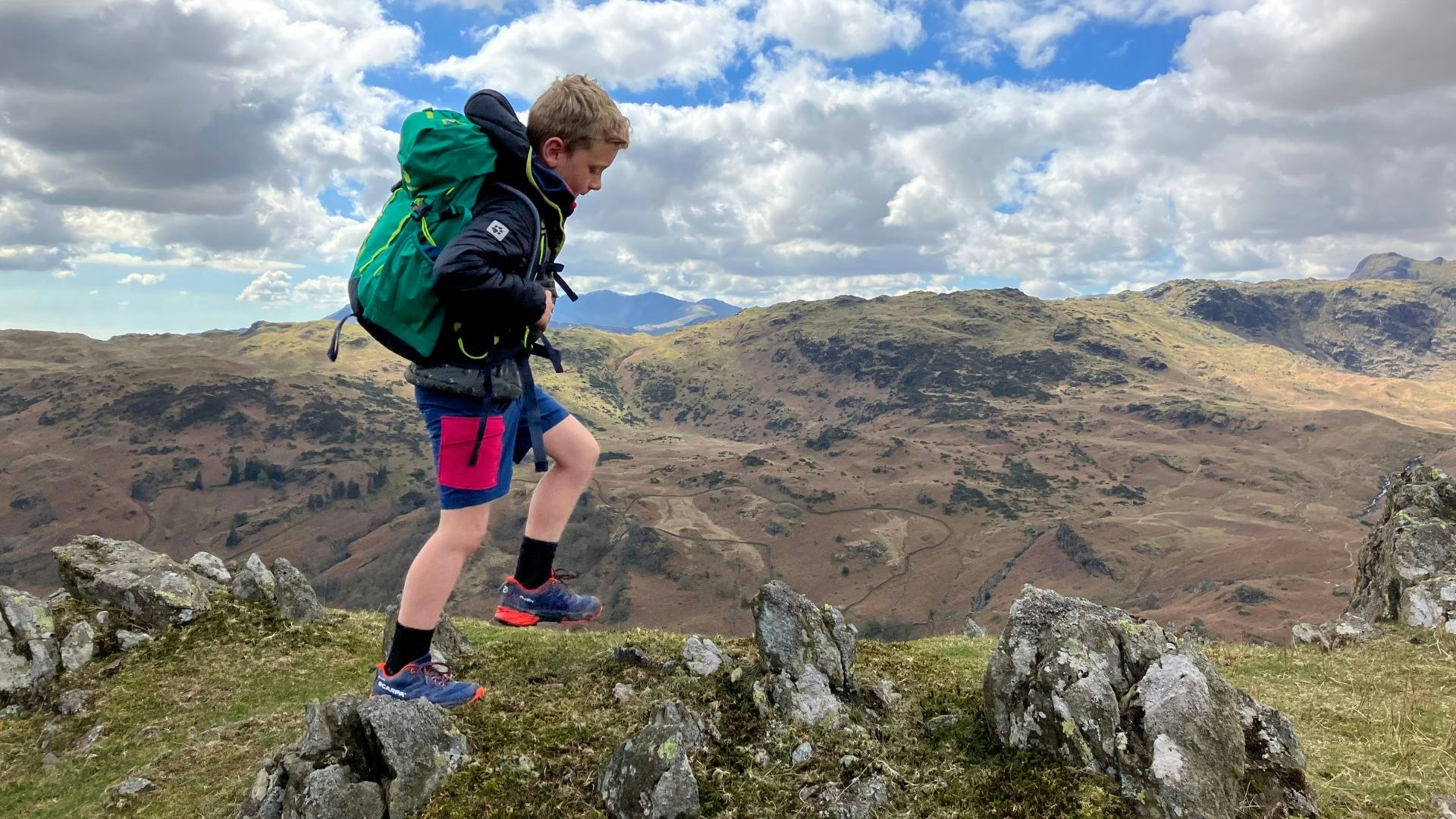 Child on summit of Helm Crag Lake District