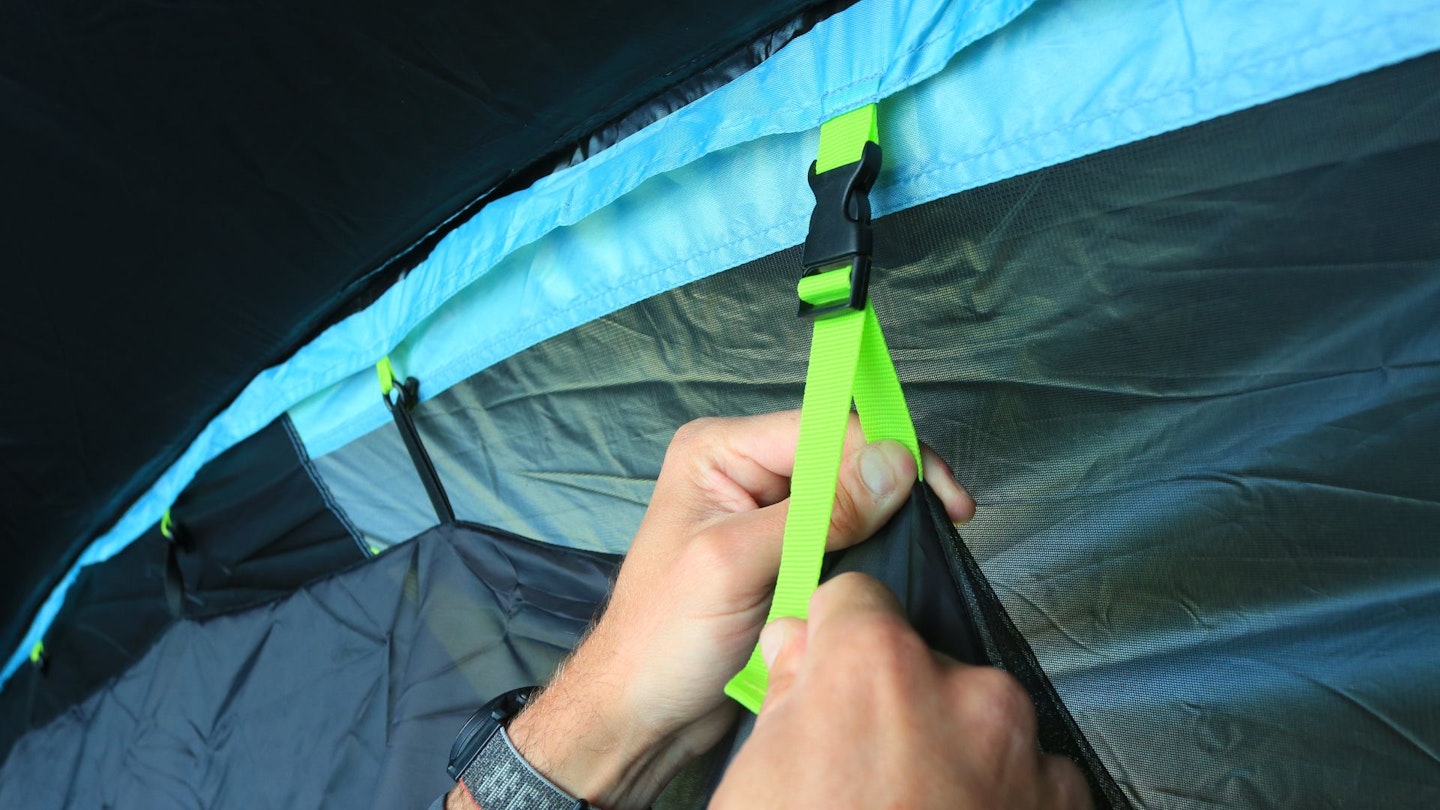 Closeup of a Coleman Meadowood 6L BlackOut Tent bedroom strap