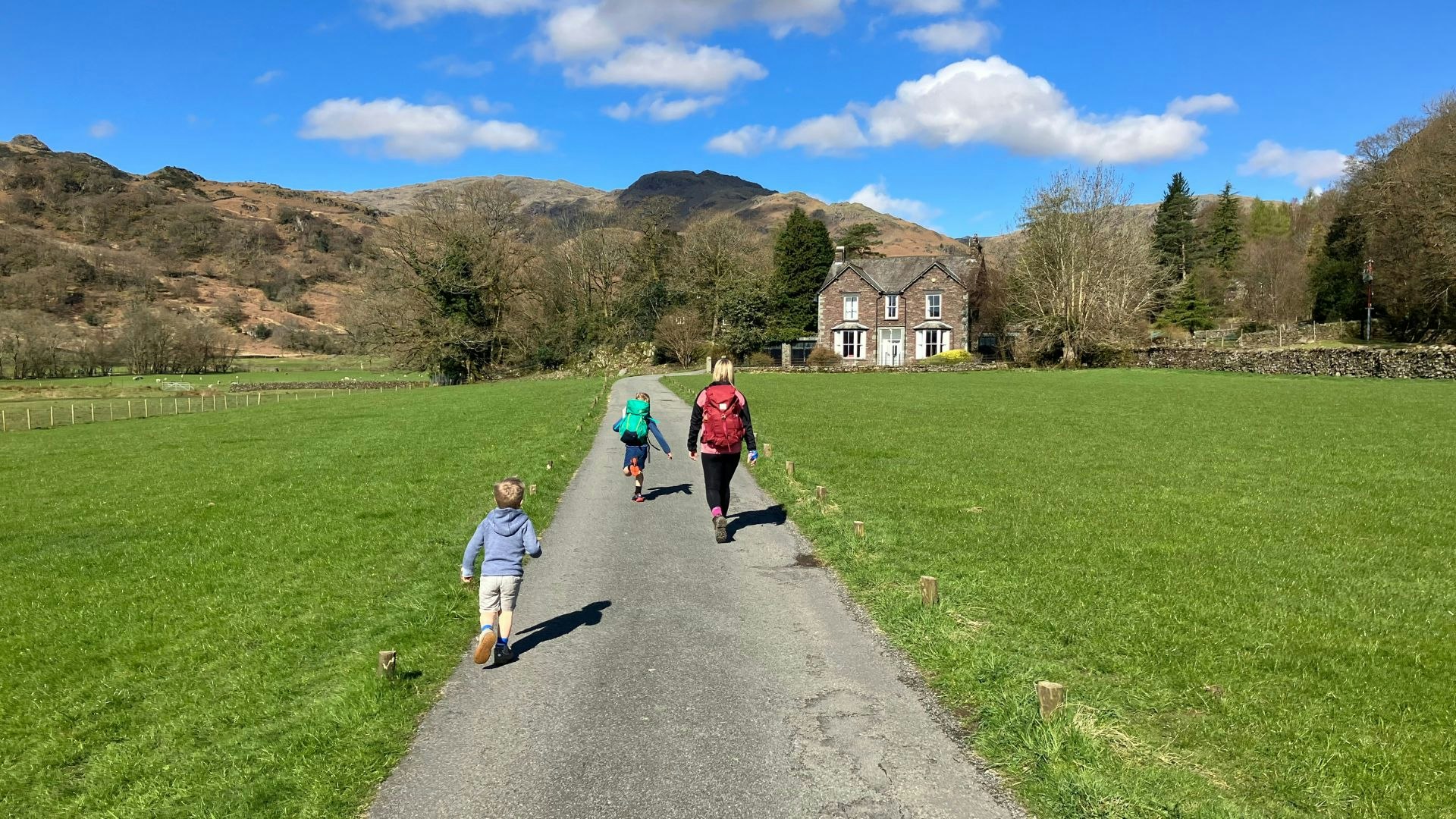 Family heading for Helm Crag from Grasmere Lake District