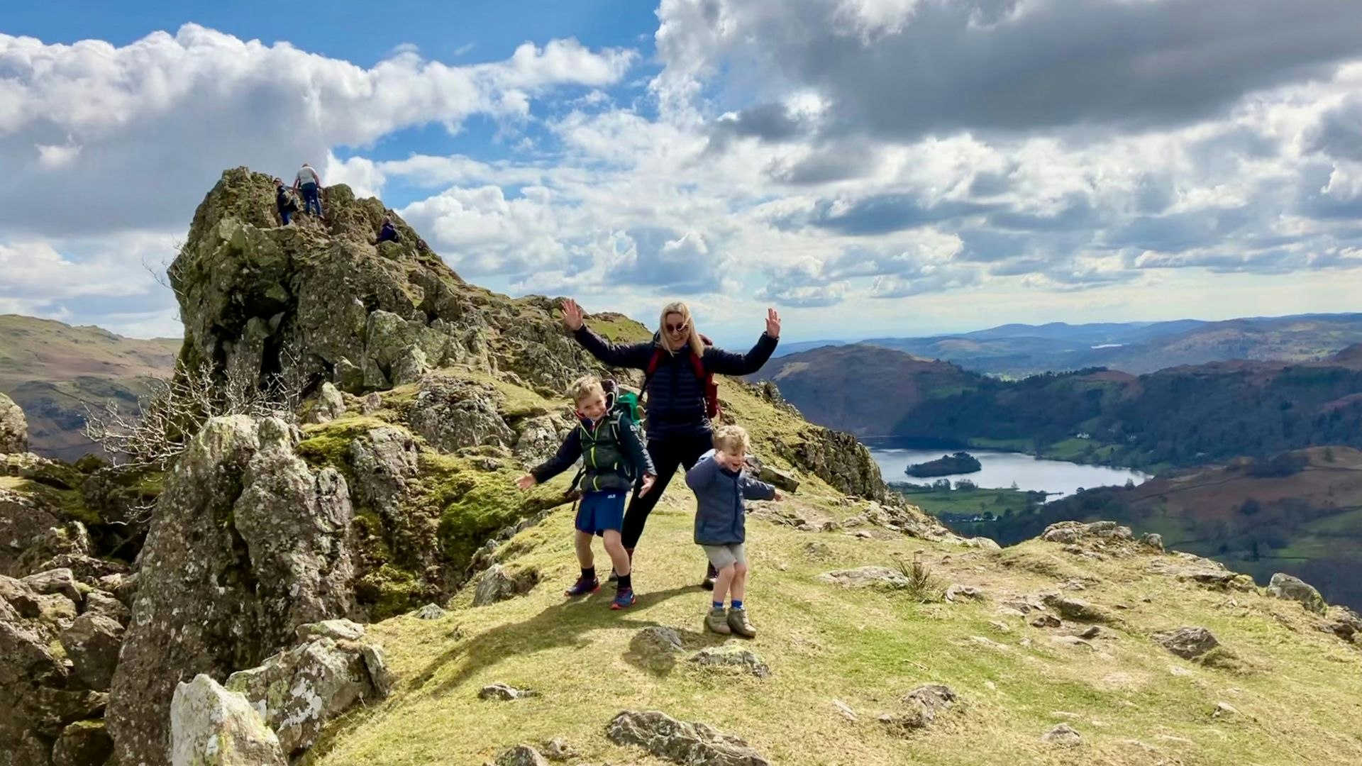 Family on summit of Helm Crag Lake District