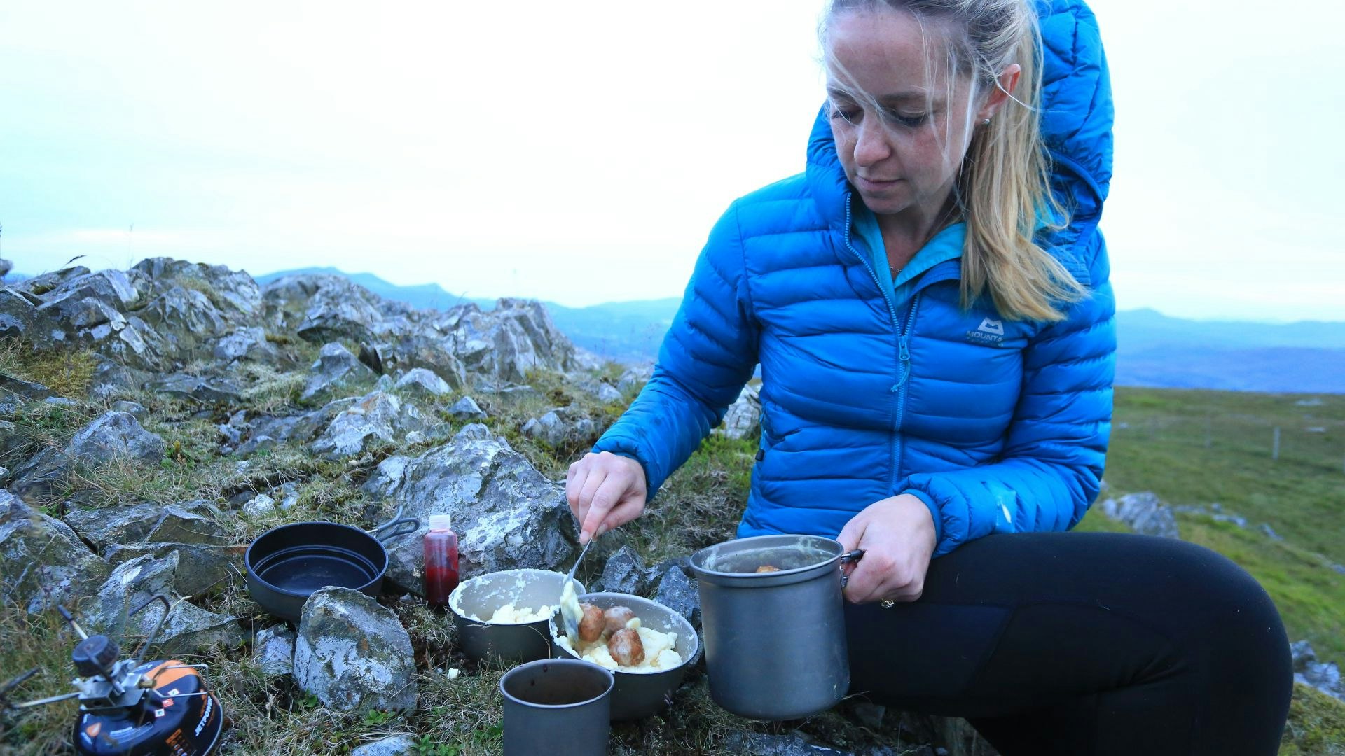 Meatballs and mash cooked on a camping stove