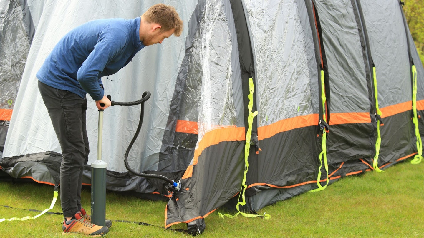 Person inflating OLPRO Blakedown Breeze 4 poles