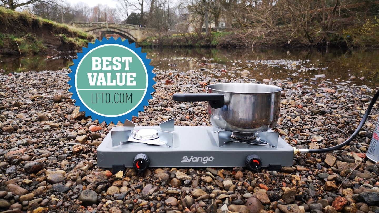 Vango Blaze stove with a pot resting on it next to a river