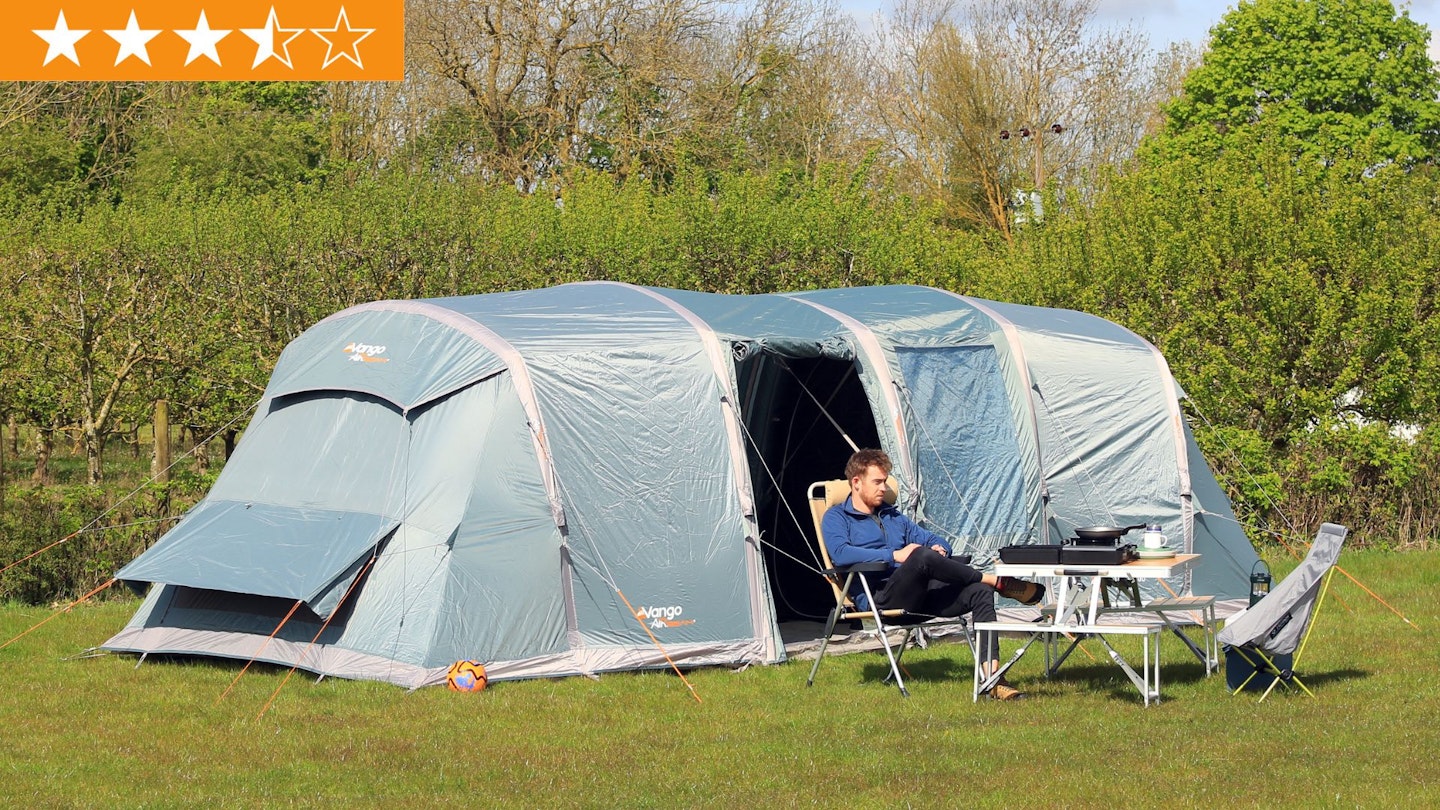 Person sitting outside Vango Castlewood Air 800XL Package with star ratings