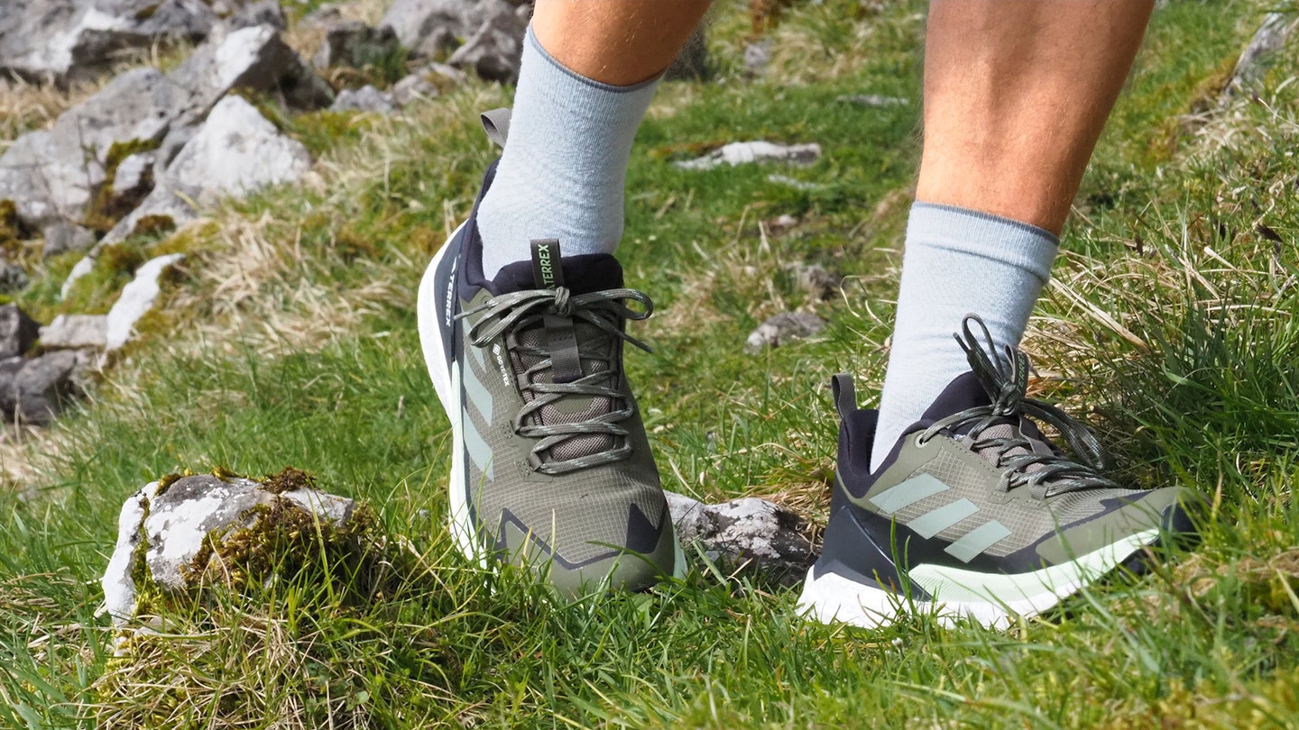 Closeup of hiker wearing Adidas Terrex Free Hiker 2.0 Low GTX