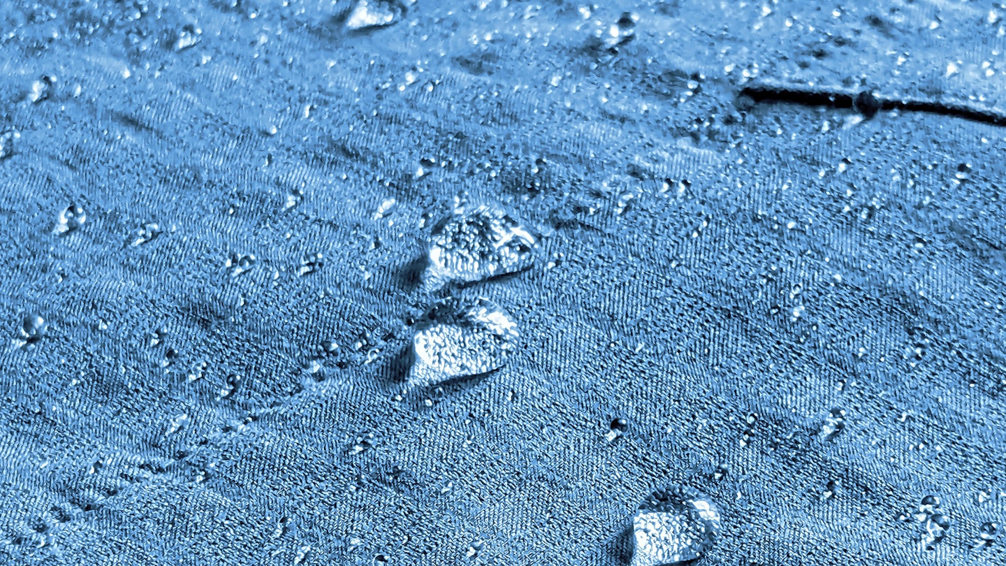 Closeup of water beading on Black Diamond Coefficient Storm Hoody fabric