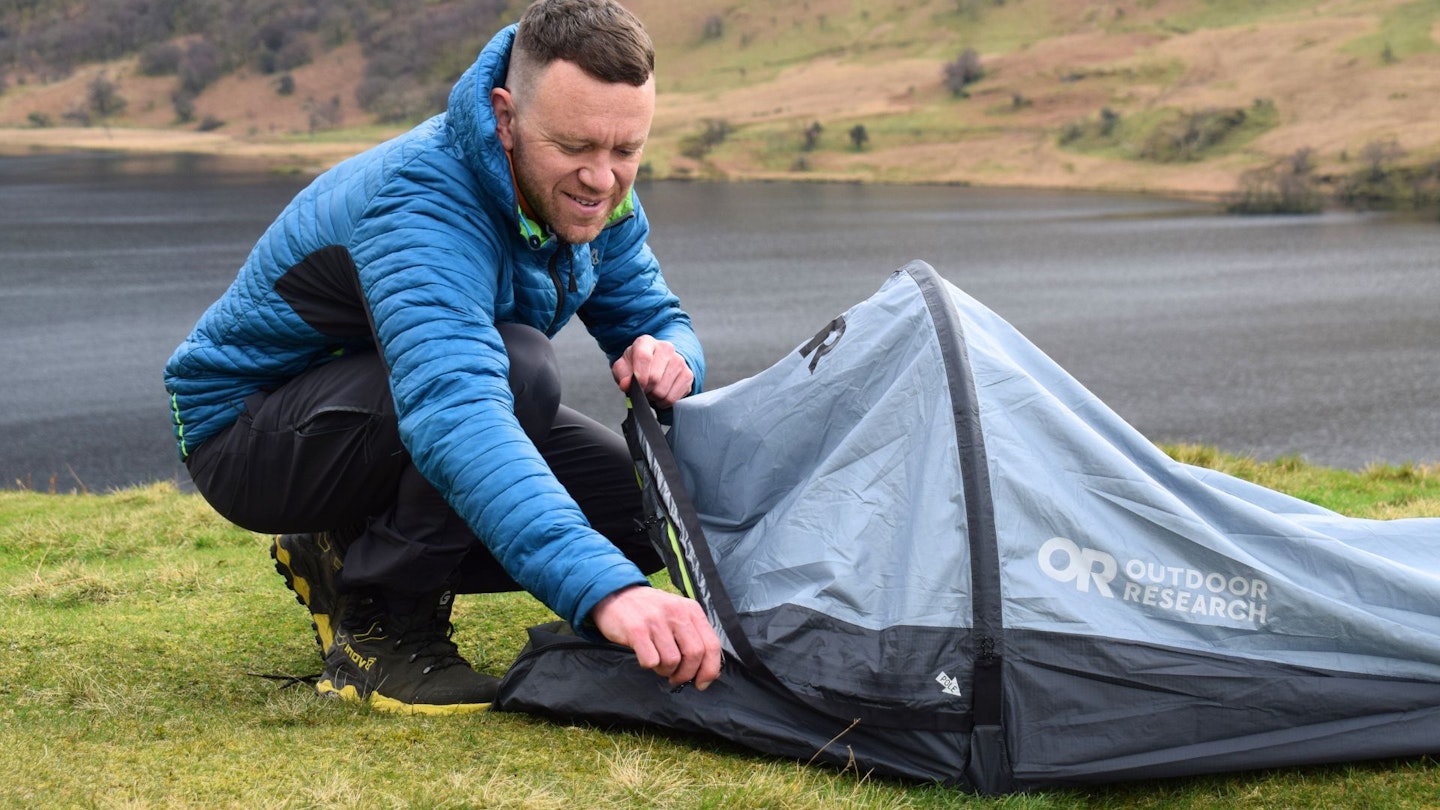 James Forrest unzipping front of Outdoor Research Helium Bivy