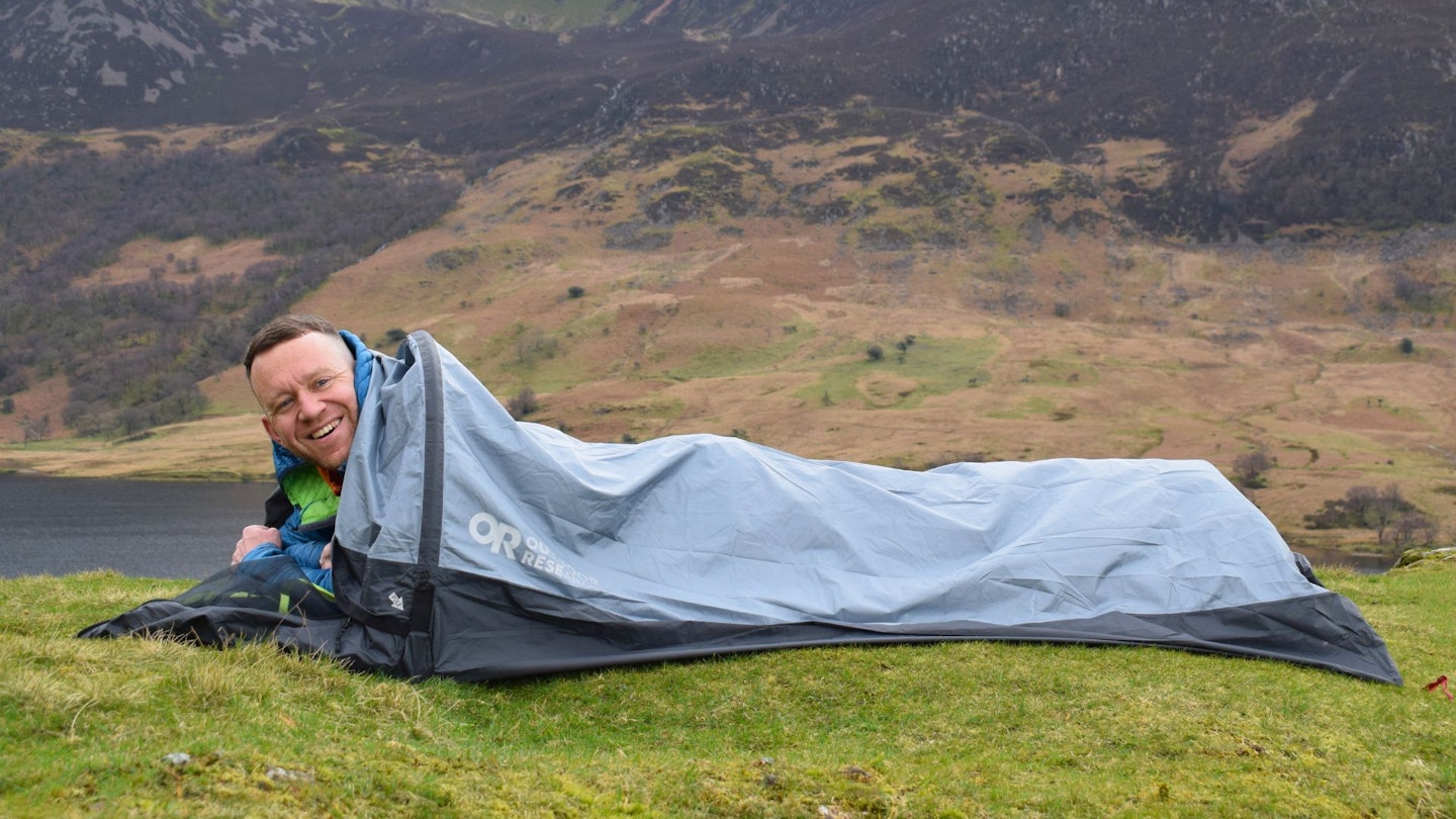James Forrest lying down in Outdoor Research Helium Bivy