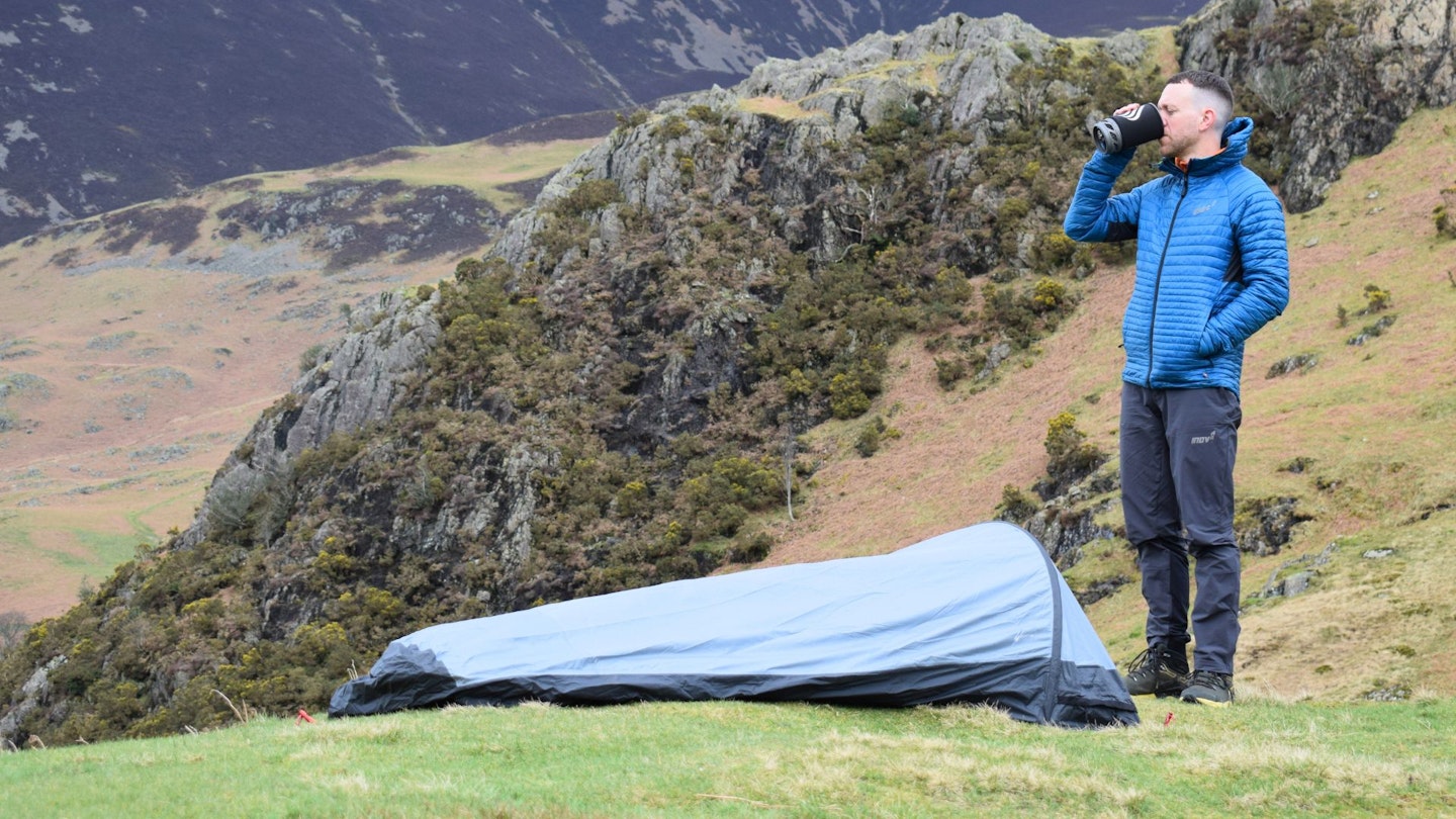 James Forrest standing next to Outdoor Research Helium Bivy