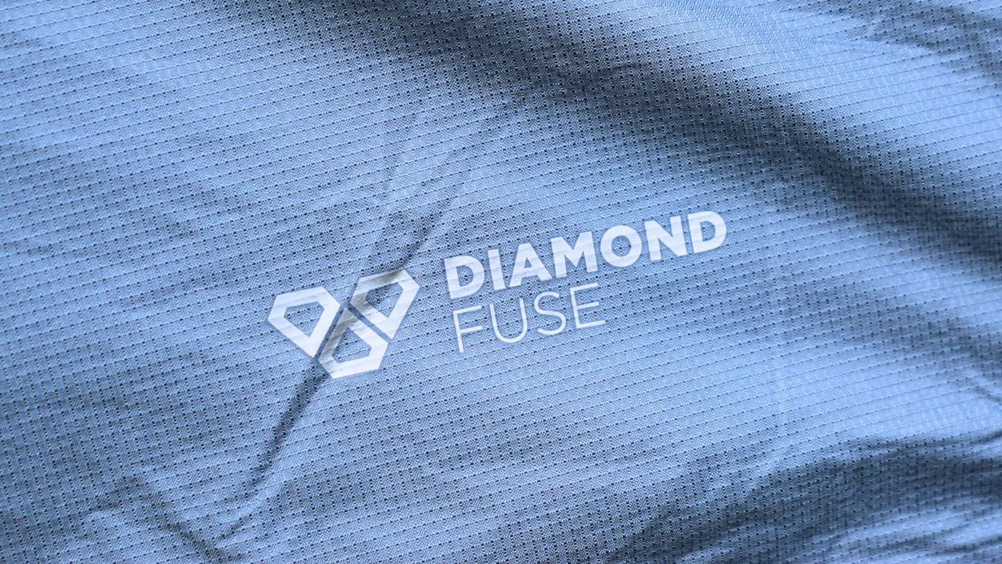 Closeup of Diamond Fuse logo printed on Outdoor Research Helium Bivy fabric