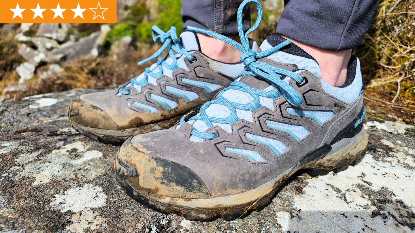 Closeup of LFTO tester wearing Scarpa Moraine GTX shoes with award star rating