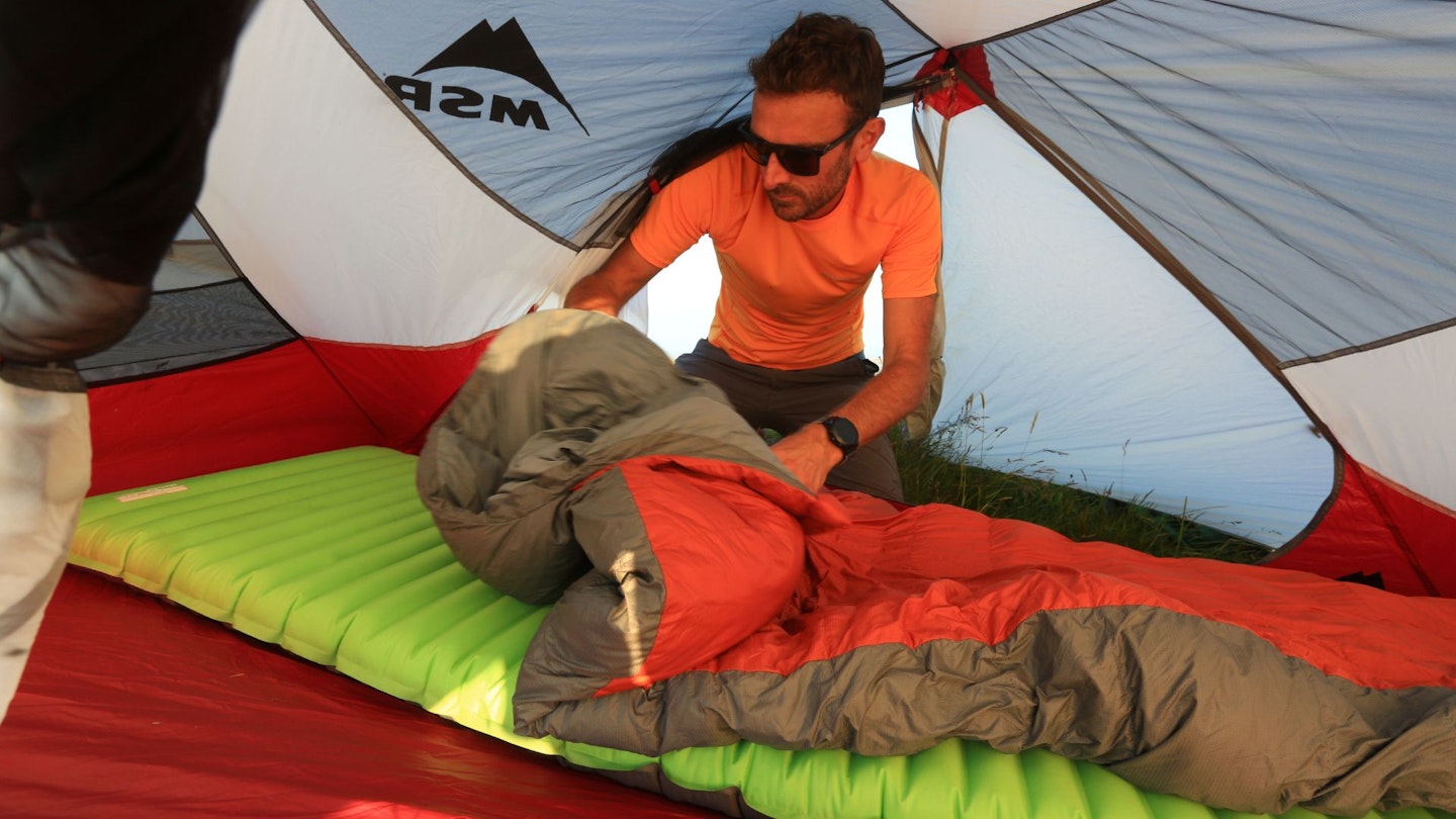 10 Setting up sleeping bag and sleeping mat in a tent