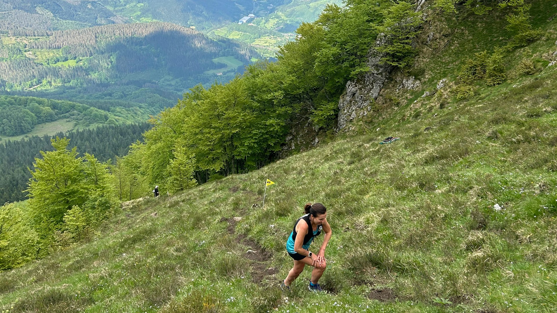 Climbing grassy hills on the Zegama trail race