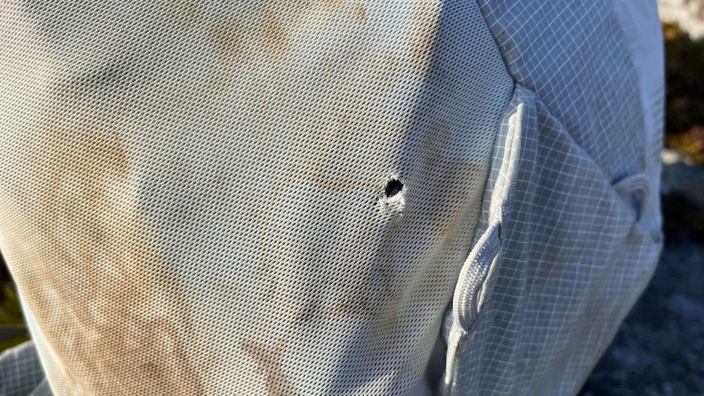 Hole worn in Deuter Aircontact Ultra 50+5 side mesh pocket