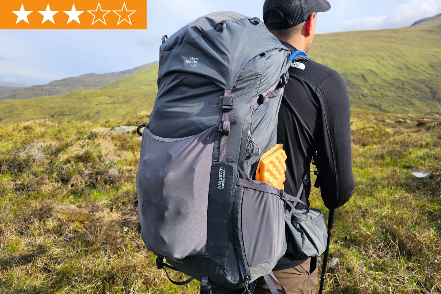 Hiker wearing Highlander Ben Nevis 65 pack with LFTO star ratings