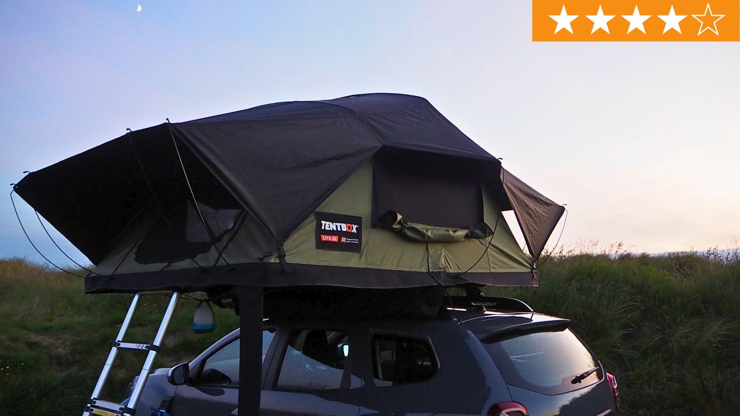 TentBox Lite XL pitched on car roof at dusk with LFTO star rating in right hand corner