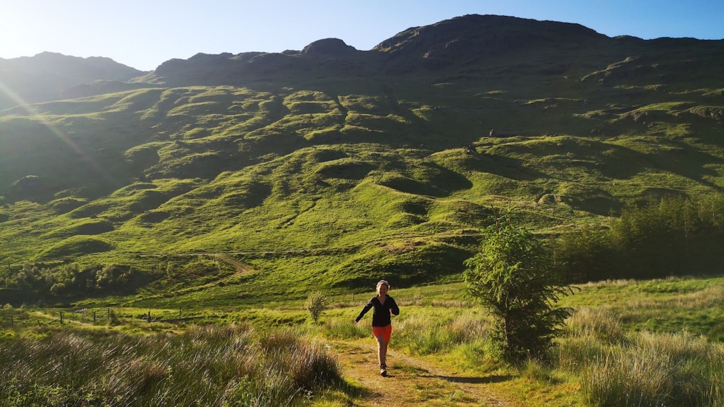 Fliss hiking in the trossachs wearing Norrona shorts